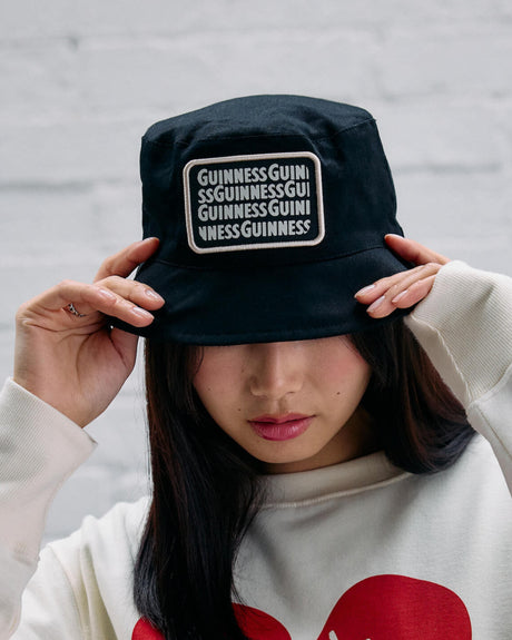 Model wearing the lovely day black bucket hat.