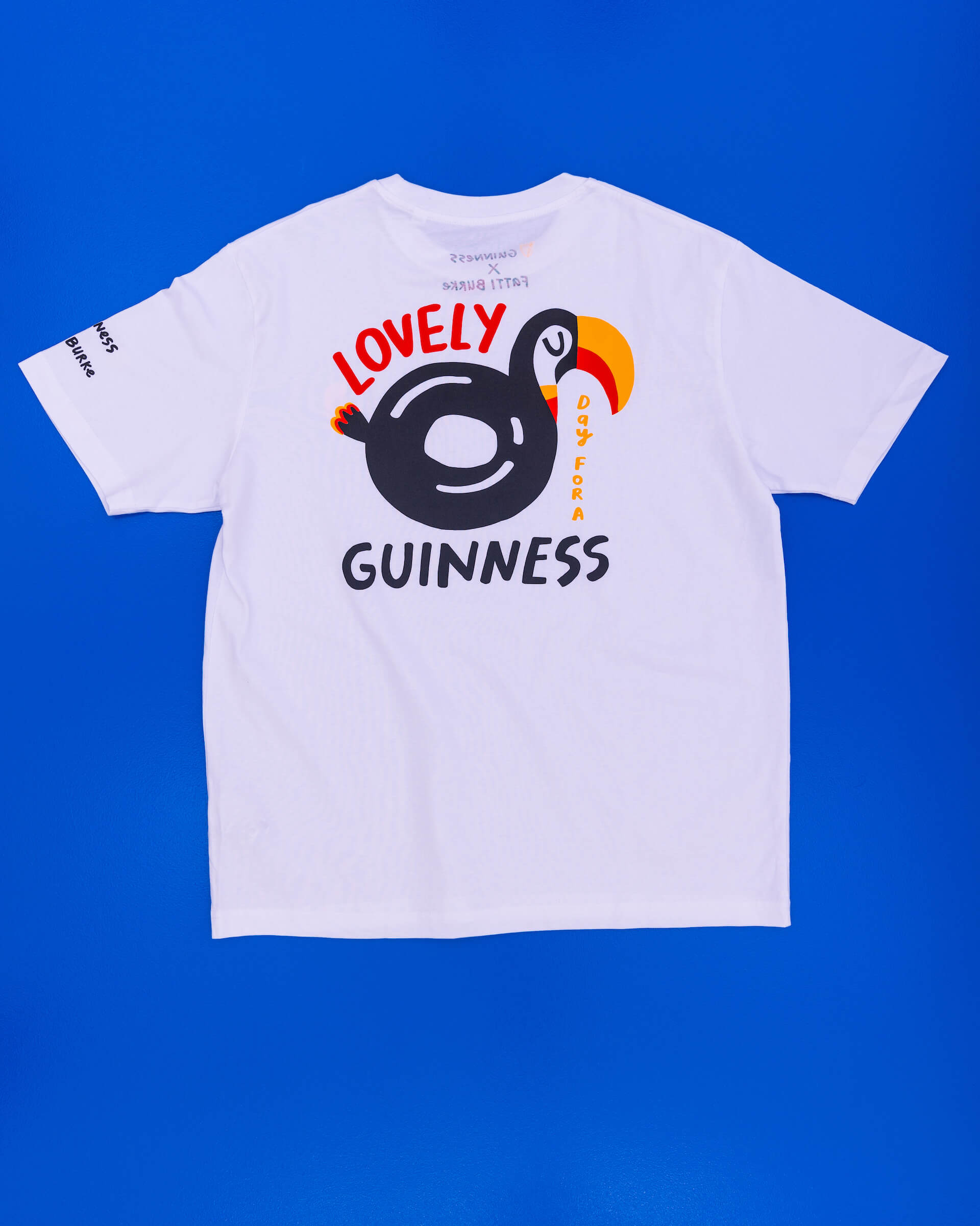 Back of the Lovely Day for a Guinness white toucan t-shirt, designed by  Fatti Burke