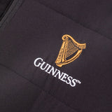 Detail of the Guinness Storehouse Exclusive black padded jacket logo.