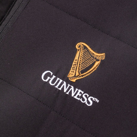 Detail of the Guinness Storehouse Exclusive black padded jacket logo.