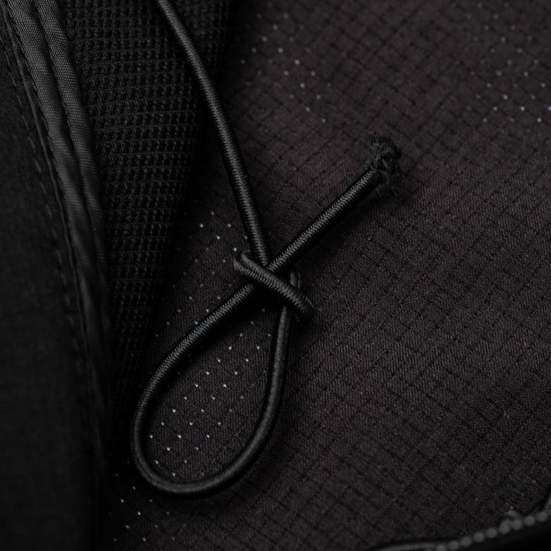 Detail of the Guinness Storehouse Exclusive black jacket adjustable hoodie.