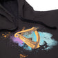Detail of the Guinness Storehouse Exclusive hoodie with the iconic Guinness harp on watercolour texture.
