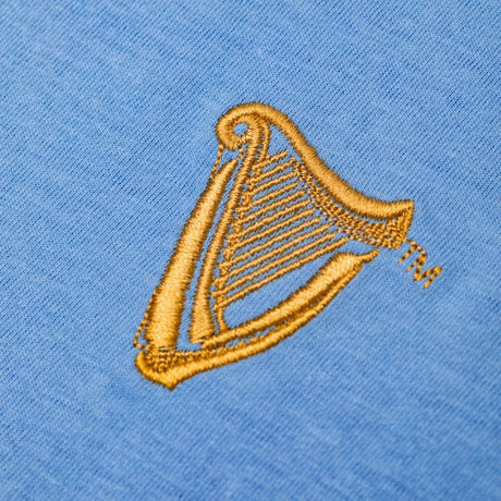 Detail of the Guinness Storehouse Exclusive, light blue, chest harp t-shirt.