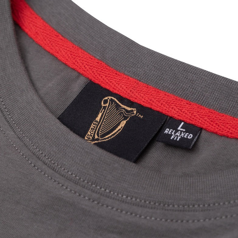 Red collar trim of the Guinness Storehouse Exclusive dark grey t-shirt.