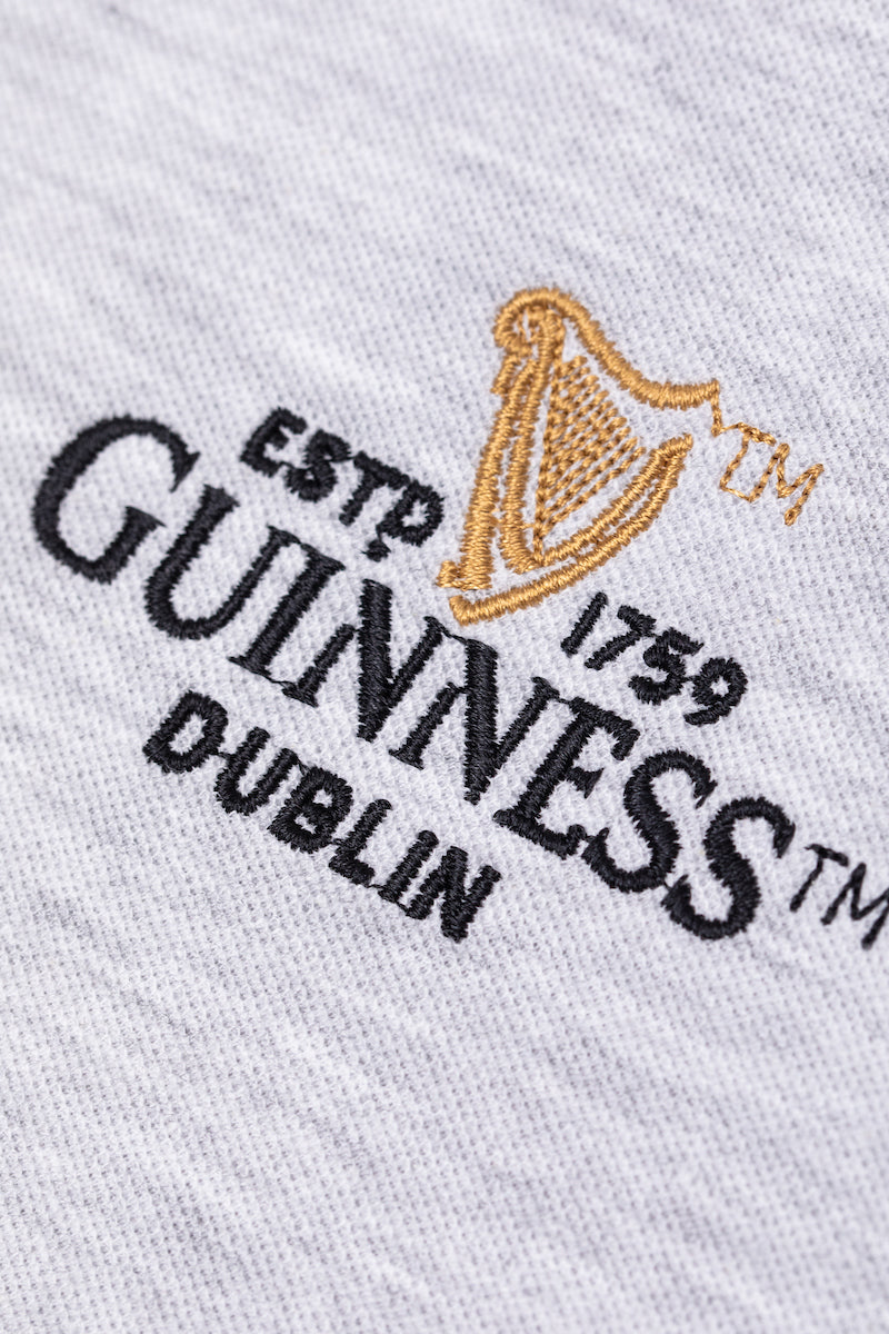 Detail of the Guinness Storehouse Exclusive grey  polo's logo.