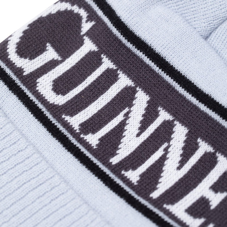 Detail image of the Guinness Storehouse Exclusive grey knitted bobble hat. 
